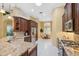Kitchen with stainless steel appliances, granite counters, and a view to the dining area at 19418 Morden Blush Dr, Lutz, FL 33558