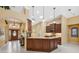 Gourmet kitchen featuring a large island, granite countertops, pendant lighting, and easy access to the living areas at 19418 Morden Blush Dr, Lutz, FL 33558