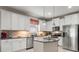 Modern kitchen with granite countertops, stainless steel appliances, and a center island at 1987 Trillium Blvd, Brooksville, FL 34604