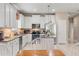 Updated kitchen with granite countertops, stainless steel appliances, and a breakfast bar at 1987 Trillium Blvd, Brooksville, FL 34604