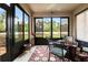 Relaxing lanai with large windows, tile flooring, and views of the backyard at 1987 Trillium Blvd, Brooksville, FL 34604