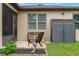 Outdoor patio area with seating, an outdoor shed, and well-maintained landscaping, offering a serene backyard setting at 1987 Trillium Blvd, Brooksville, FL 34604