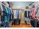 Spacious walk-in closet with hardwood floors, shelving, and racks for ample storage space at 1987 Trillium Blvd, Brooksville, FL 34604