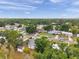Aerial view of homes in a tree-lined neighborhood with a mix of architectural styles at 2012 Warrington Way, Tampa, FL 33619