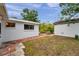 This home includes a fenced backyard, and a concrete patio, perfect for dining or entertaining outdoors at 2012 Warrington Way, Tampa, FL 33619