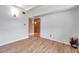 Bright bedroom with wood-look floors, a closet, and neutral walls offers a blank canvas at 2012 Warrington Way, Tampa, FL 33619