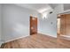 Bright bedroom with wood-look floors, a closet, and neutral walls offers a blank canvas at 2012 Warrington Way, Tampa, FL 33619