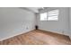 Bright bedroom with wood-look floors, and neutral walls offers a blank canvas at 2012 Warrington Way, Tampa, FL 33619