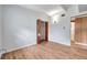 Bright bedroom with wood-look floors, a closet, and neutral walls offers a blank canvas at 2012 Warrington Way, Tampa, FL 33619