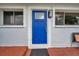 Welcoming front door with modern light fixture and sidelight windows at 2012 Warrington Way, Tampa, FL 33619