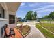 Inviting front porch with chairs, showcases the entrance to the home at 2012 Warrington Way, Tampa, FL 33619