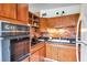 Traditional kitchen design with wooden cabinets and brick backsplash at 2012 Warrington Way, Tampa, FL 33619