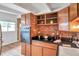 Classic kitchen with brick accent wall and built-in oven at 2012 Warrington Way, Tampa, FL 33619