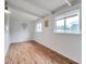 Sunlit room with wood floors, white walls, and a heart decoration at 2012 Warrington Way, Tampa, FL 33619