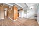 The open living room features wood-look floors and access to the kitchen at 2012 Warrington Way, Tampa, FL 33619