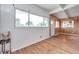 Bright living room features wood-look floors, painted walls and a large picture window at 2012 Warrington Way, Tampa, FL 33619