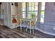 Bright dining area featuring a table, chairs, natural light from windows, and modern wood-look flooring at 21040 Lazy Days Cir, Lutz, FL 33558