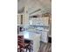 Bright kitchen boasts white appliances, ample counter space, stylish backsplash, and contemporary flooring at 21040 Lazy Days Cir, Lutz, FL 33558