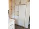 Bright kitchen with white appliances, updated cabinets, and contemporary flooring at 21040 Lazy Days Cir, Lutz, FL 33558