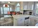 Open-concept kitchen and living room with stylish decor, comfortable seating, and abundant natural light at 21040 Lazy Days Cir, Lutz, FL 33558