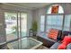 Comfortable living room with plenty of natural light, featuring a plush sectional sofa, modern coffee table, and stylish decor at 21040 Lazy Days Cir, Lutz, FL 33558