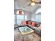 Comfortable living room with plenty of natural light, featuring a plush sectional sofa, modern coffee table, and stylish decor at 21040 Lazy Days Cir, Lutz, FL 33558
