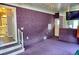 Spacious living room featuring steps and open door to bathroom at 21040 Lazy Days Cir, Lutz, FL 33558