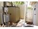 Outdoor space with storage shed, utility box, and partially enclosed patio at 21040 Lazy Days Cir, Lutz, FL 33558