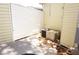 Small fenced yard with a concrete patio and outdoor air conditioning units at 21040 Lazy Days Cir, Lutz, FL 33558