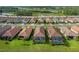 An overhead shot of a community that highlights properties with pools and screened lanais at 3051 Francoa Dr, Odessa, FL 33556