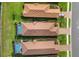 An overhead view of the homes with terra cotta roofs, in-ground pools, and verdant landscaping at 3051 Francoa Dr, Odessa, FL 33556