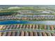 Stunning aerial view reveals a community with homes situated around a beautiful lake at 3051 Francoa Dr, Odessa, FL 33556