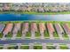 Breathtaking aerial view of a waterfront community highlighting the prime location with water views and lush landscaping at 3051 Francoa Dr, Odessa, FL 33556