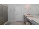 Bathroom features a glass shower, a single vanity, and neutral color palette at 3051 Francoa Dr, Odessa, FL 33556