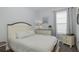 This bedroom features a comfortable bed, a dresser, and a nightstand by the window at 3051 Francoa Dr, Odessa, FL 33556