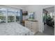 Comfortable bedroom boasts a large window view and a nearby en-suite bath and sliding door access to the lanai at 3051 Francoa Dr, Odessa, FL 33556