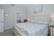 Charming bedroom with a nautical theme, featuring an en-suite bath and lots of natural light from the large window at 3051 Francoa Dr, Odessa, FL 33556