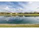 Scenic lake view showcasing the beautiful waterfront properties with lush green surroundings on a sunny day at 3051 Francoa Dr, Odessa, FL 33556