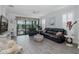 Spacious living room offers sliding glass doors to the lanai and pool, with tile flooring and comfortable seating at 3051 Francoa Dr, Odessa, FL 33556