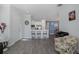 Cozy living area with bar seating looking into the kitchen, creating an ideal space for entertaining and relaxation at 3051 Francoa Dr, Odessa, FL 33556