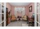 Cozy home office features two chairs, a desk, and lovely decor at 3051 Francoa Dr, Odessa, FL 33556