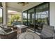 Covered patio with comfortable seating and outdoor fire pit at 3051 Francoa Dr, Odessa, FL 33556