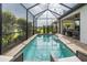 Covered pool with a scenic view and outdoor seating area at 3051 Francoa Dr, Odessa, FL 33556