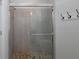 Shower featuring glass door and pebble flooring at 3051 Francoa Dr, Odessa, FL 33556