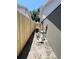 View of a professionally installed AC unit in backyard, near a new privacy fence at 3304 Honeymoon Ln, Holiday, FL 34691