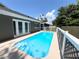 Inviting backyard pool featuring clear blue water and a surrounding patio for relaxation and outdoor enjoyment at 3304 Honeymoon Ln, Holiday, FL 34691