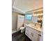 Bright bathroom features a shower, vanity, sink, and new fixtures at 3304 Honeymoon Ln, Holiday, FL 34691
