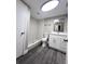 Bathroom featuring a walk-in shower, modern vanity, and great lighting at 3304 Honeymoon Ln, Holiday, FL 34691