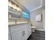 Clean bathroom with quartz countertops, modern vanity, and updated fixtures at 3304 Honeymoon Ln, Holiday, FL 34691