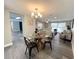 Open-concept layout combining dining, living, and kitchen areas, perfect for entertaining at 3304 Honeymoon Ln, Holiday, FL 34691